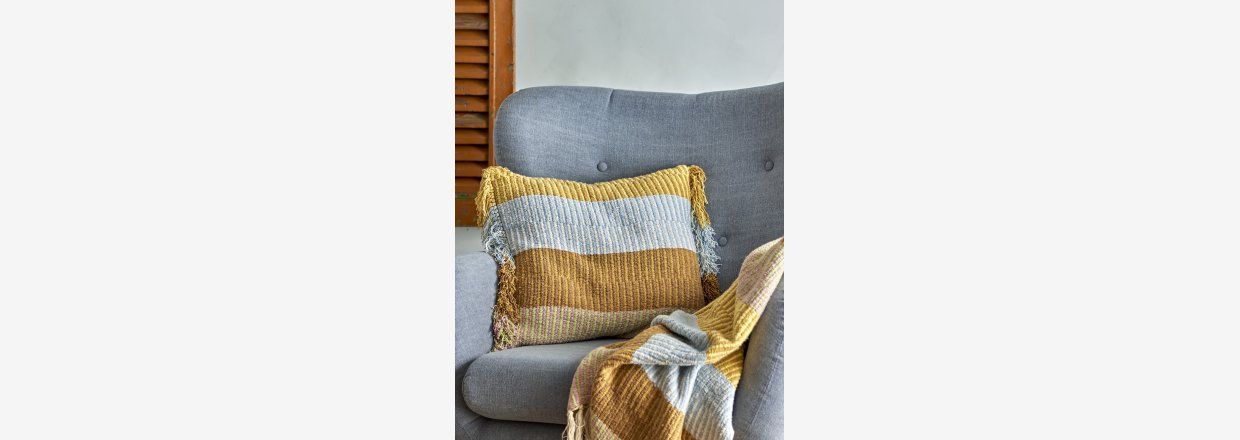 Hygge, farver og bredygtighed  plaider med frynser og kvaster